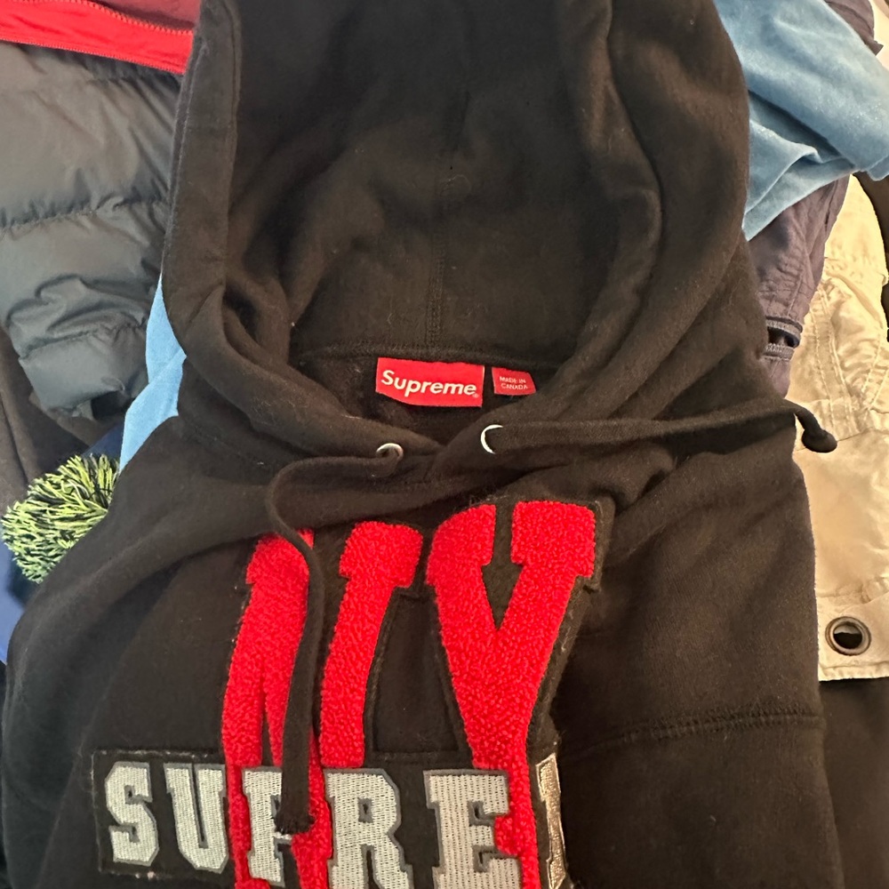 Supreme Black Hoodie with Red Tag